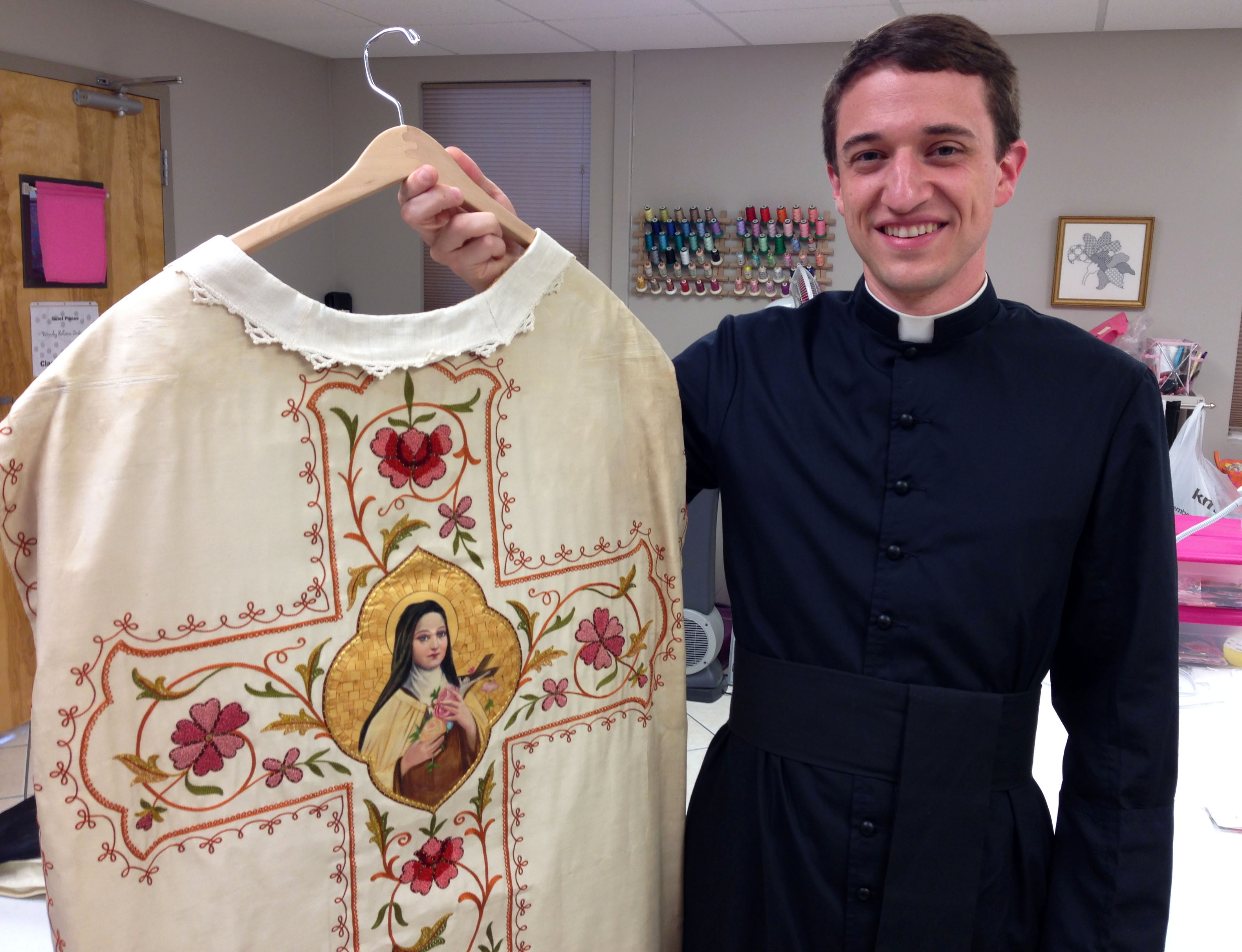 Fr. Garett O'Brien with his antique hand embroidered vestment with thread painting an goldwork.